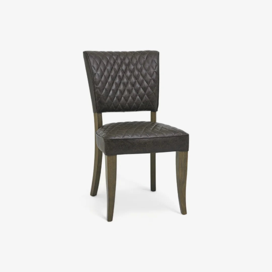 Front and angled image of the Landon Fumed Oak Dining Chairs Saddle Faux Leather with dark oak frame.