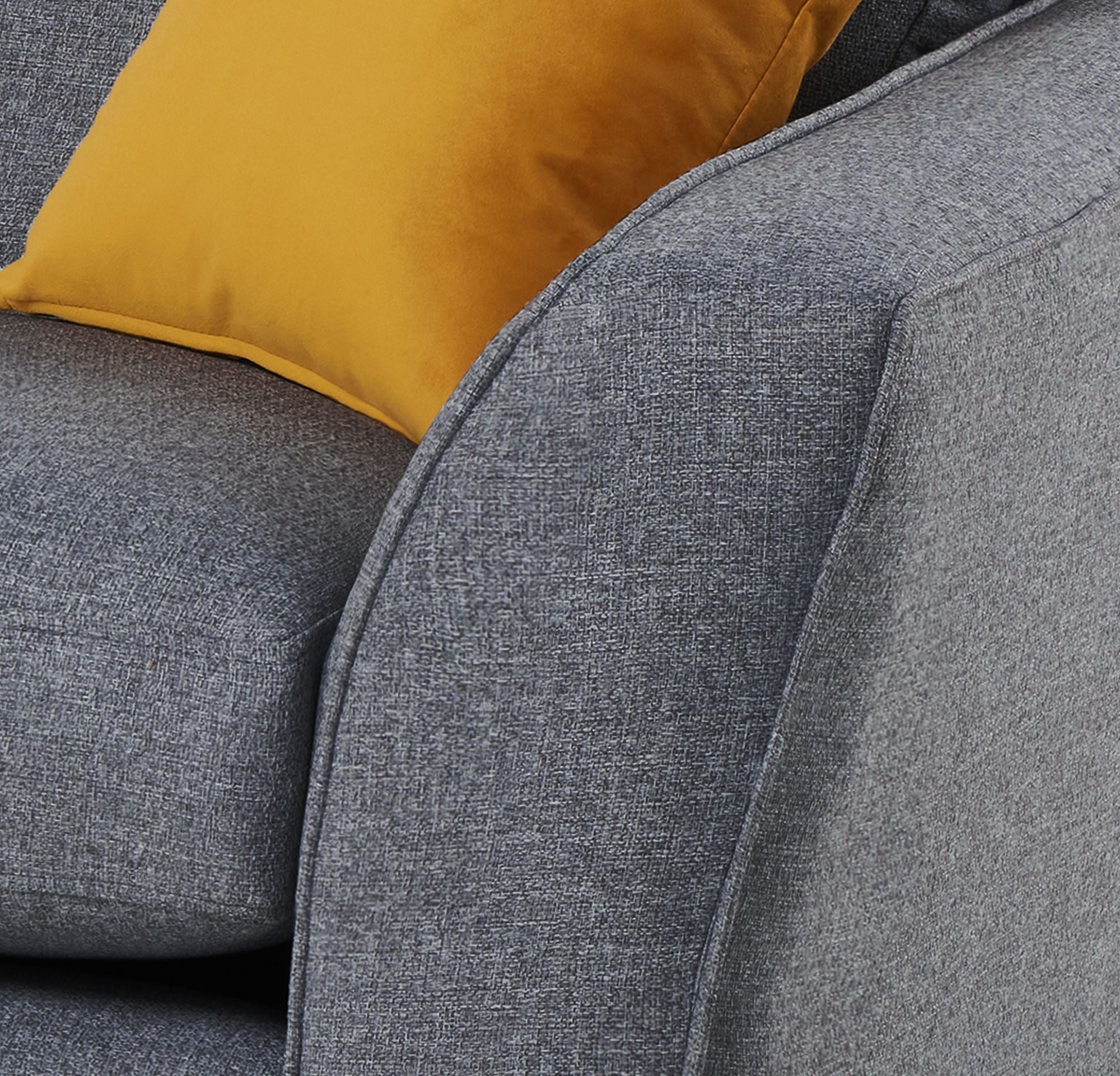 Close up of Libby sofa arm in denim showing dual piping detail