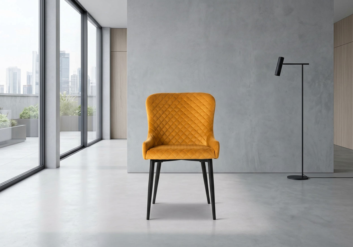 Mustard yellow chair in a modern room with large windows and a gray wall.
