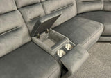 Grey recliner sofa with a built-in cup holder and storage compartment.