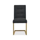 Front view of the Lindos Fabric Dining Chairs with black square-stitched upholstery and brass legs.
