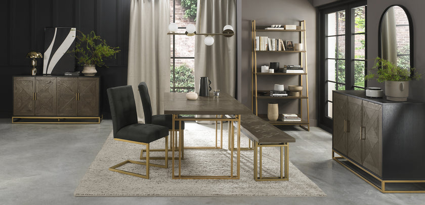 Image of the Lindos Fabric Dining Chairs with black square-stitched upholstery and brass legs styled with some of NCF's other Dining Furniture.