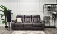 Front view of the Kobe 3 Seater Recliner Sofa styled with a cushion