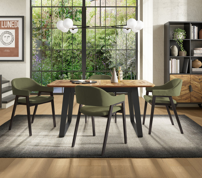 Image of the Candice Velvet dining chairs with curved back, armrests, and dark legs styled with NCF's Dining Furniture.