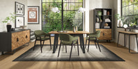 Image of the Candice Velvet dining chairs with curved back, armrests, and dark legs styled with NCF's Dining Furniture.