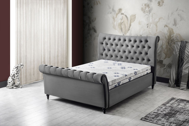 Angled view of the St Tropez Double Size Ottoman Bed Frame in a room