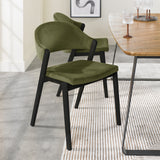 An angled image of the Candice Velvet dining chairs with a curved back and dark oiled legs