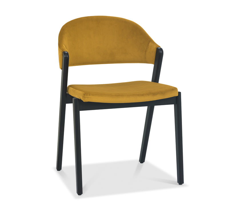 Front and angled image of the Candice Velvet Dining Chair with curved back and dark legs.