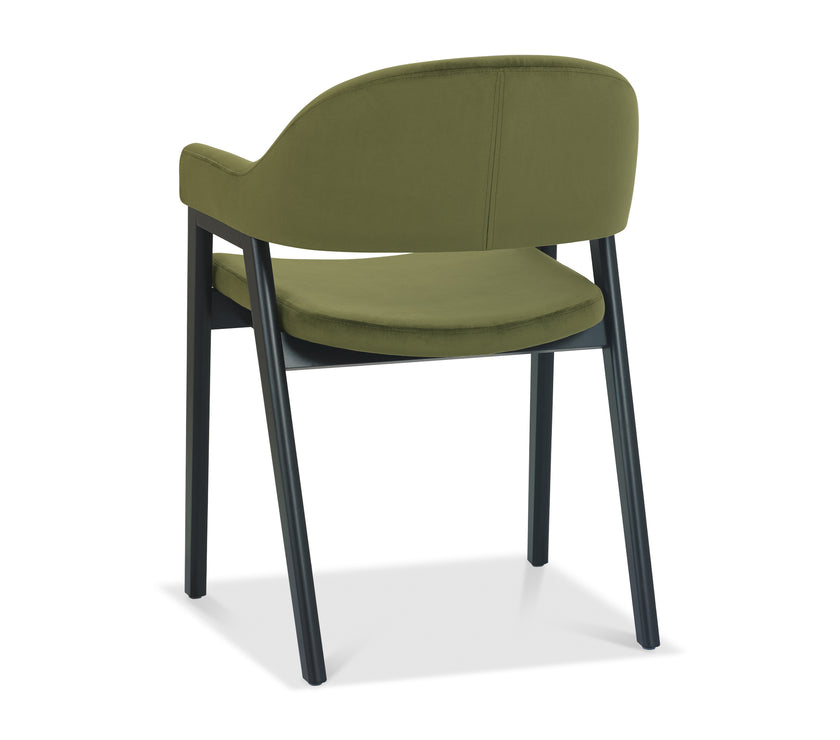 Angled and back image of the Candice Velvet dining chairs with curved back, armrests, and dark legs.