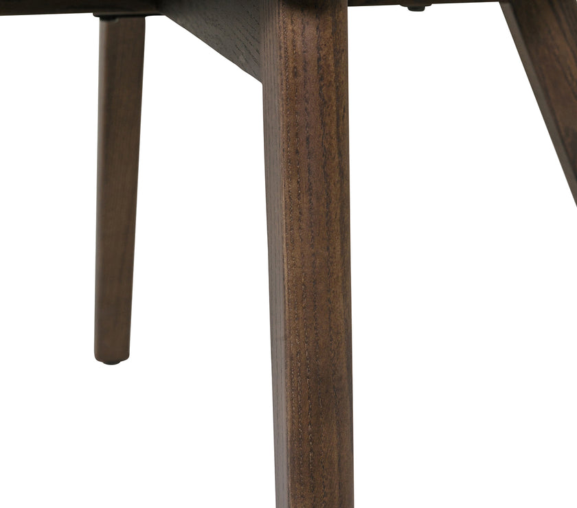 Up close view of the Everest Dining Chairs with plush padding and sturdy legs.