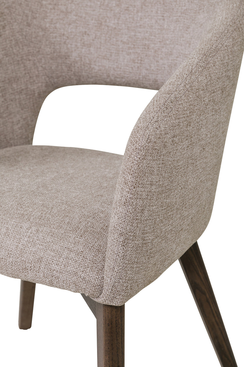 Up close image of the Everest Dining Chairs with plush padding and sturdy legs.