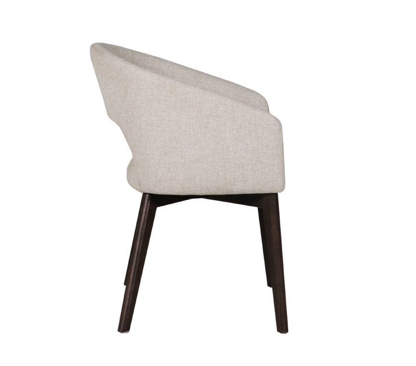 Side view of the Everest Fabric Dining Chairs with plush padding and sturdy legs.