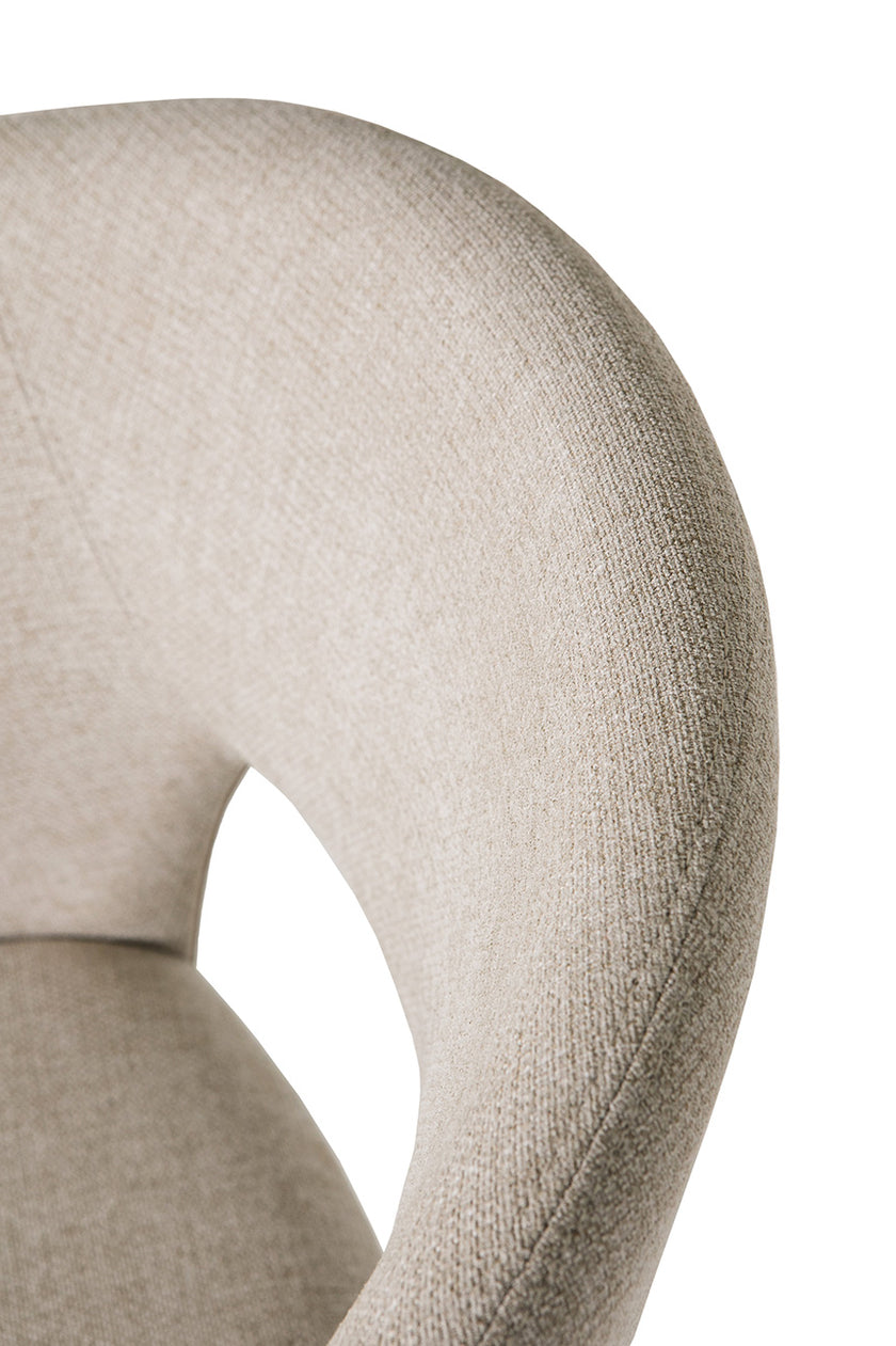 Up close image of the Everest Fabric Dining Chairs with plush padding and sturdy legs.