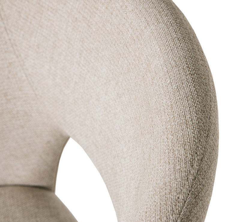 Up close image of the Everest Fabric Dining Chairs with plush padding and sturdy legs.