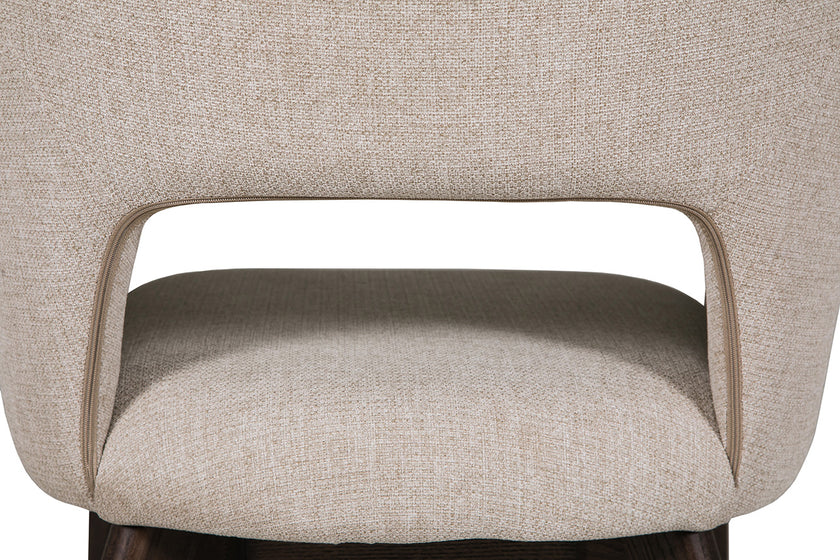 Up close and back view of theEverest Fabric Dining Chairs with plush padding and sturdy legs.