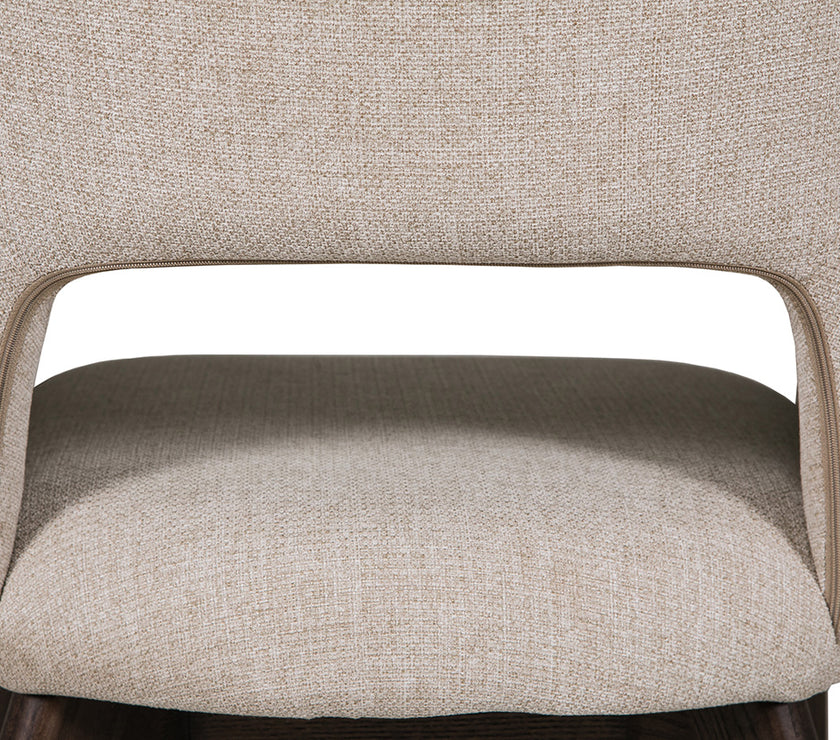 Up close and back view of theEverest Fabric Dining Chairs with plush padding and sturdy legs.