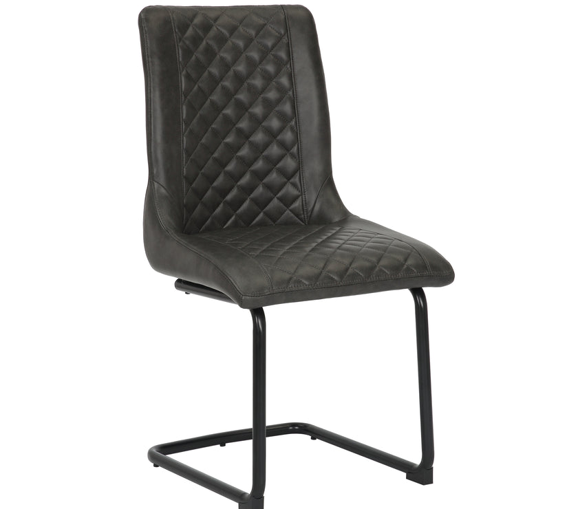 Angled mage of the Boston Cantilever black Dining Chairs: Stylish faux leather, cantilever legs