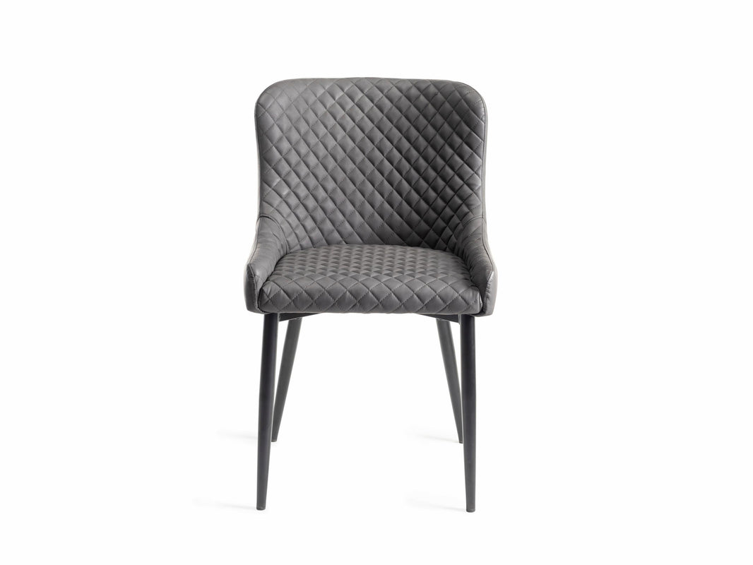 Front view of the Lozanne Faux Leather Dining Chairs with diamond stitching and metal legs.