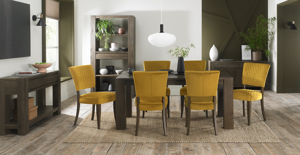 Landon Fumed Oak Dining Chairs with dark oak frame and mustard velvet seat styled with NCF's Dining Furniture.