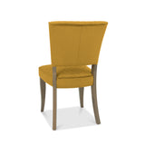 Back and angled image of the Landon Fumed Oak Dining Chairs with dark oak frame and mustard velvet seat.