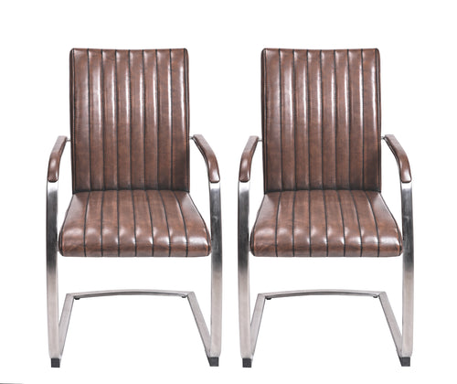 Front view of the Triumph Cantilever Faux Leather Dining Chairs with armrests and steel legs.