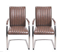 Front view of the Triumph Cantilever Faux Leather Dining Chairs with armrests and steel legs.