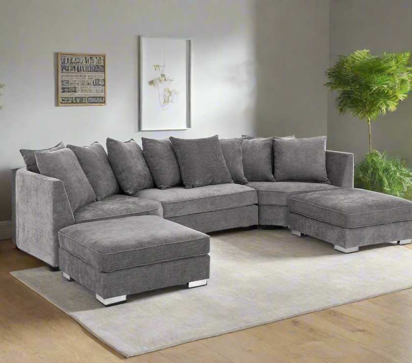Modern gray L-shaped sectional sofa with plush cushions and two matching ottomans, perfect for a cozy and stylish living room. Upholstered in soft, durable fabric, this spacious sofa offers ultimate comfort and contemporary design. Ideal for relaxing, entertaining, or lounging in style.