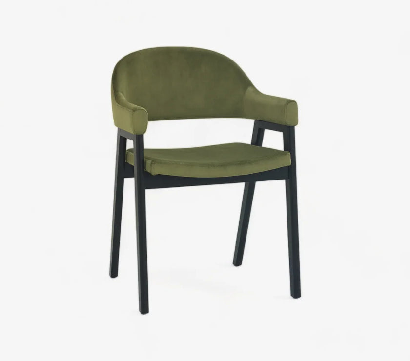 Angled and front image of the Candice Velvet dining chairs with curved back, armrests, and dark legs.