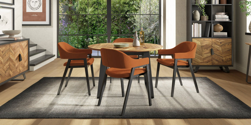 Image of the Henderson Round Dining Table being styled with NCF's Dining Furniture.