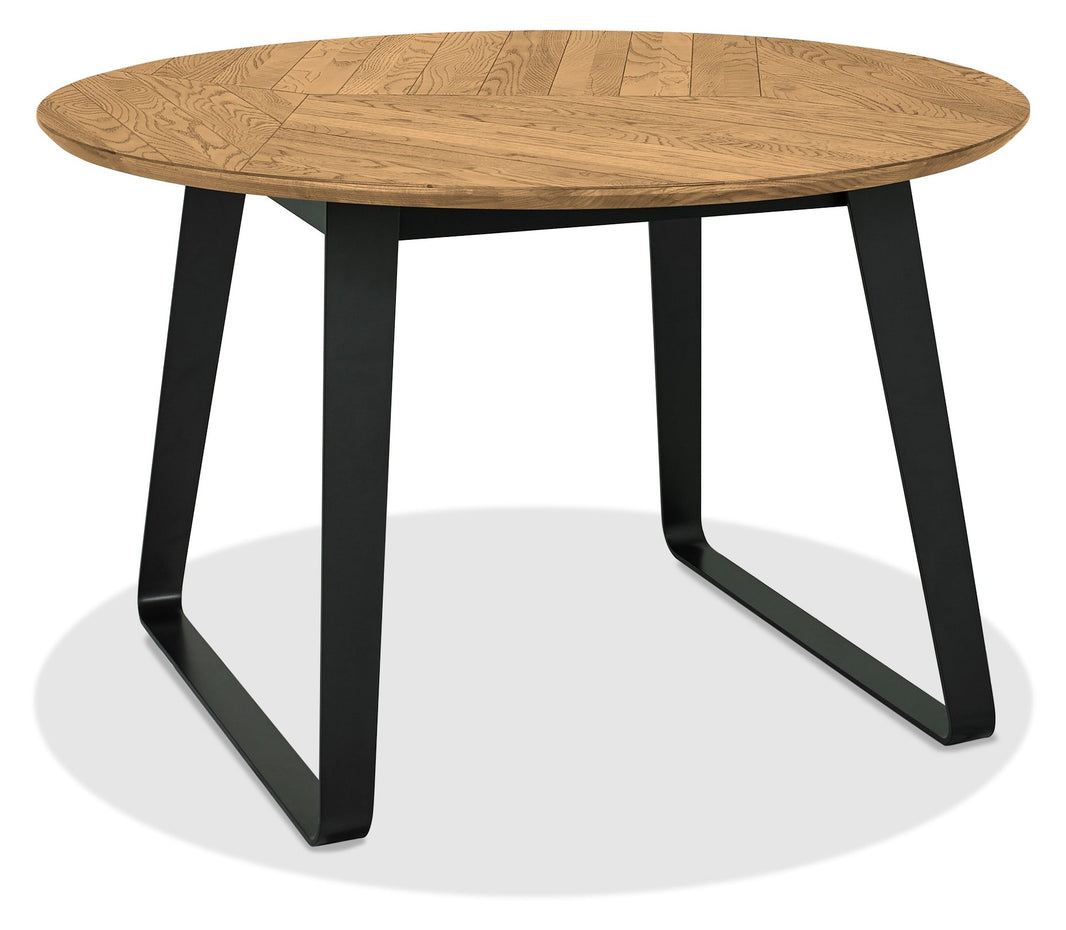 Angled view of the Henderson Round Dining Table.