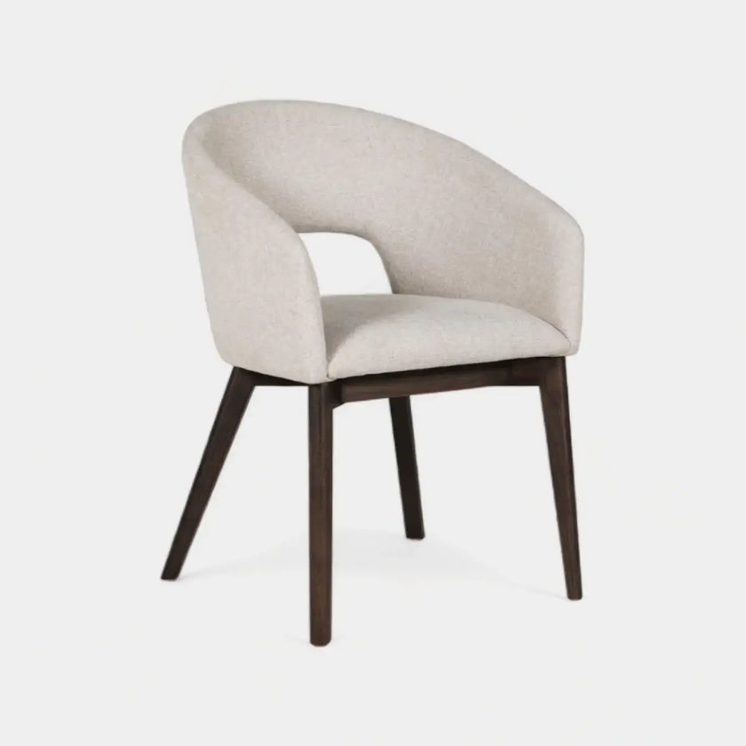 Front and angled image of the Everest Fabric Dining Chairs with plush padding and sturdy legs.