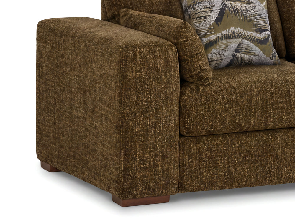Close-up of an olive green textured fabric sofa with a patterned accent pillow on a white background.