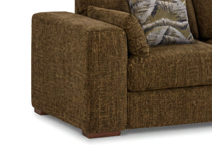 Close-up of an olive green textured fabric sofa with a patterned accent pillow on a white background.