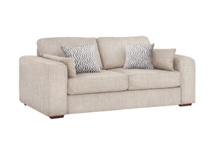 A light beige fabric sofa with two patterned throw pillows, shown on a plain white background.