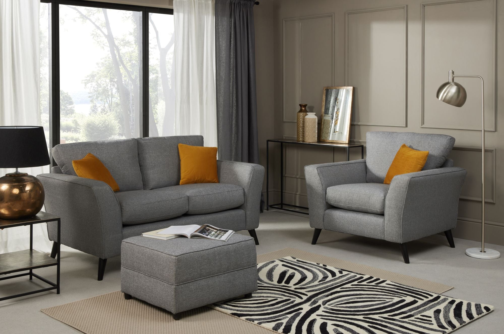 Libby 2 seater sofa, armchair and footstool in Charcoal colour shown in a room setting