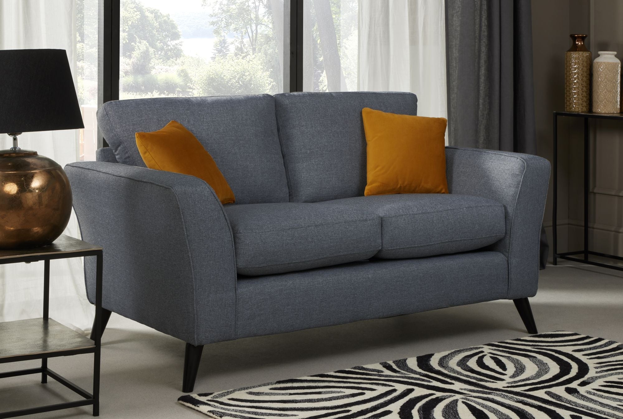Libby 2 seater sofa in denim shown as room set up 