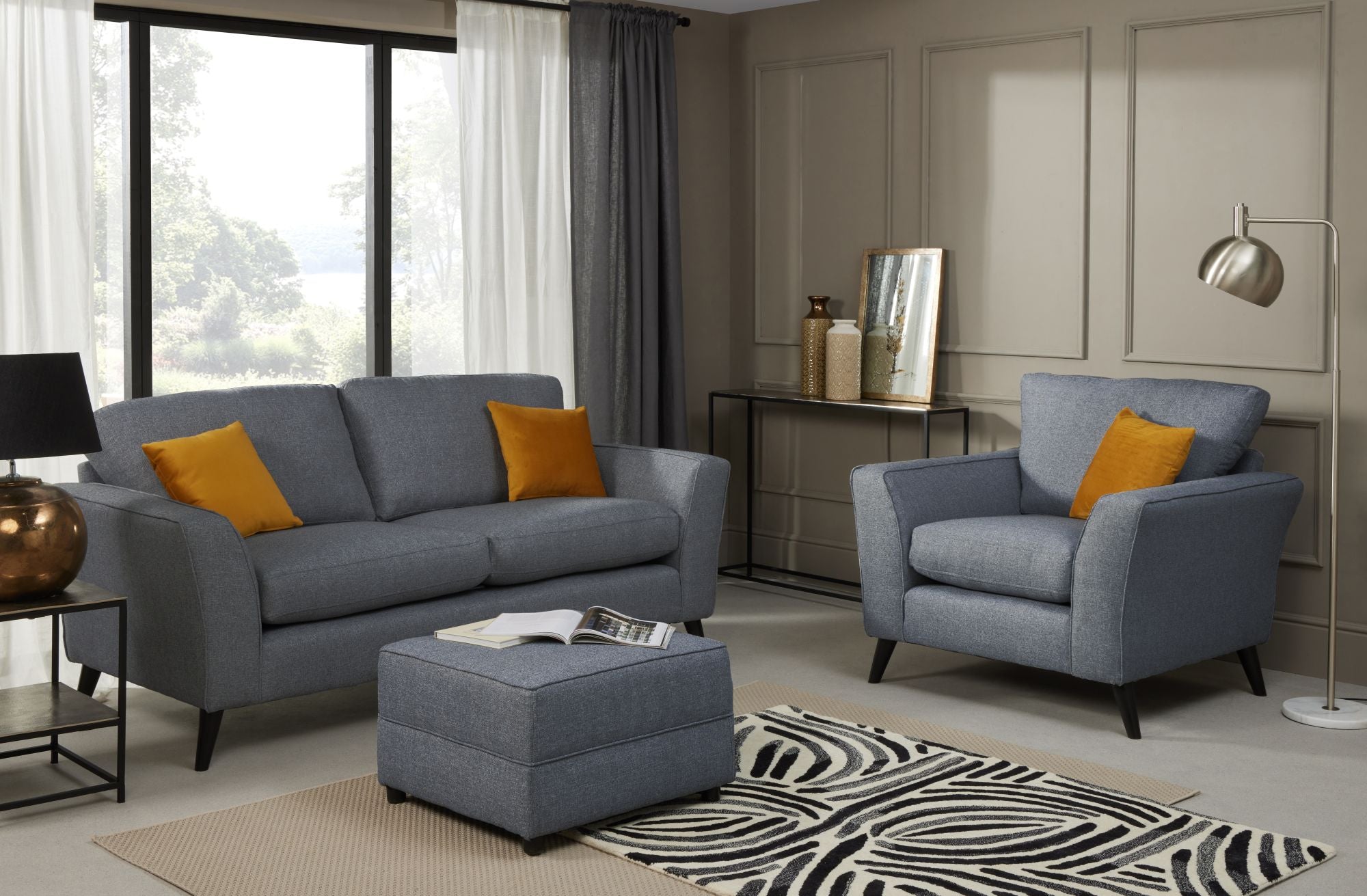 Libby 3 seater, armchair and footstool in denim show in a room setting