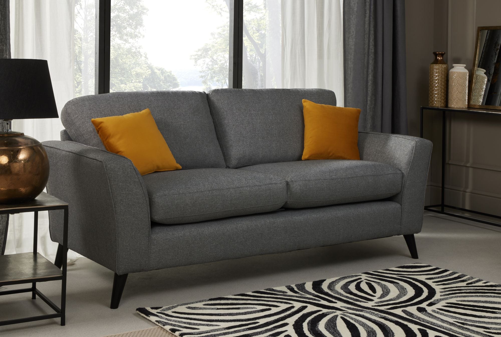 Libby 3 seater sofa in charcoal shown in a room setting