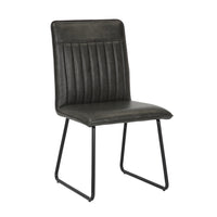 Angled image of the Black Manhattan Faux Leather Dining Chair with black metal legs and high back