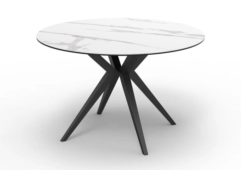 Modern round table with Ceramic top and black metal legs on a white background