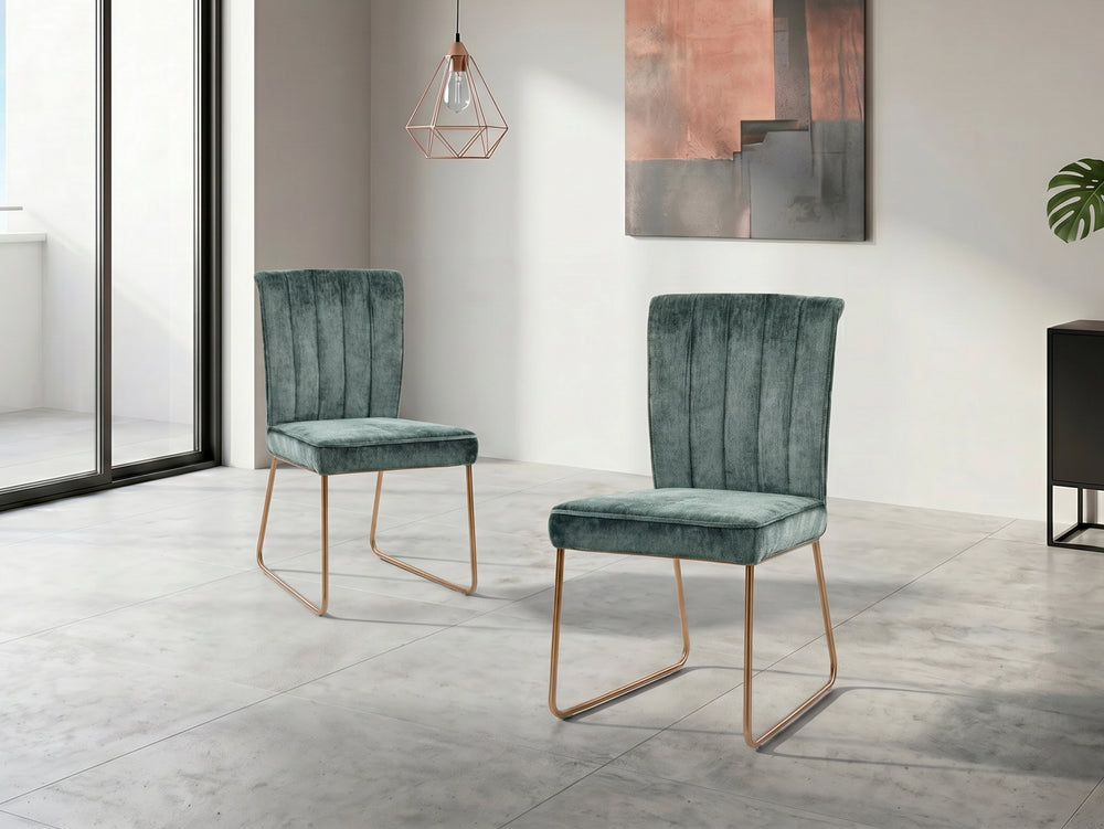Pair of green velvet chairs in a modern room