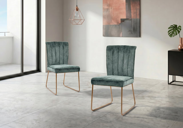 Pair of green velvet chairs in a modern room