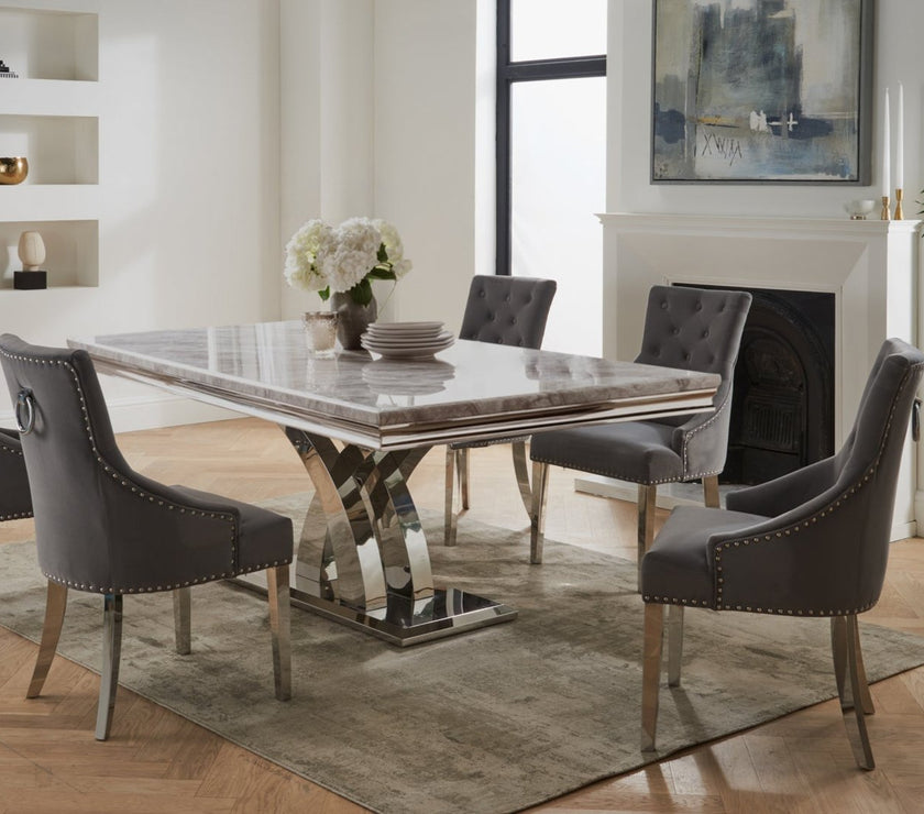 Image of the Belvedere Knockerback Velvet Dining Chairs around a dining table