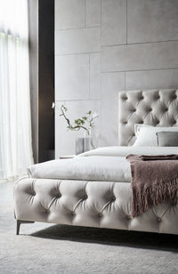 Beige tufted footboard and headboard