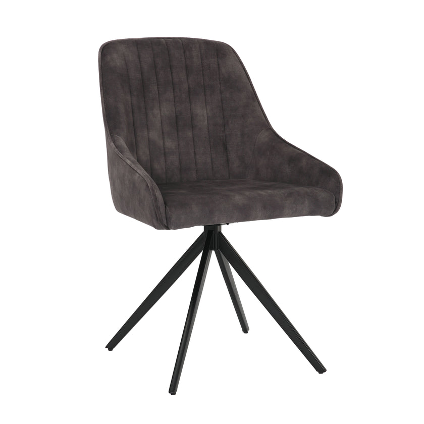 Angled view of the Sofia light grey swivel dining chairs with black metal legs and velvet seat.