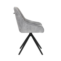 Side image of the Sofia light grey swivel dining chairs with black metal legs and velvet seat.