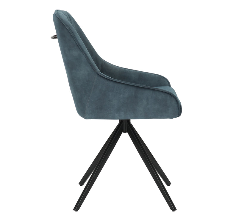 Side view of the Sofia velvet blue swivel dining chairs with black metal legs and velvet seat.