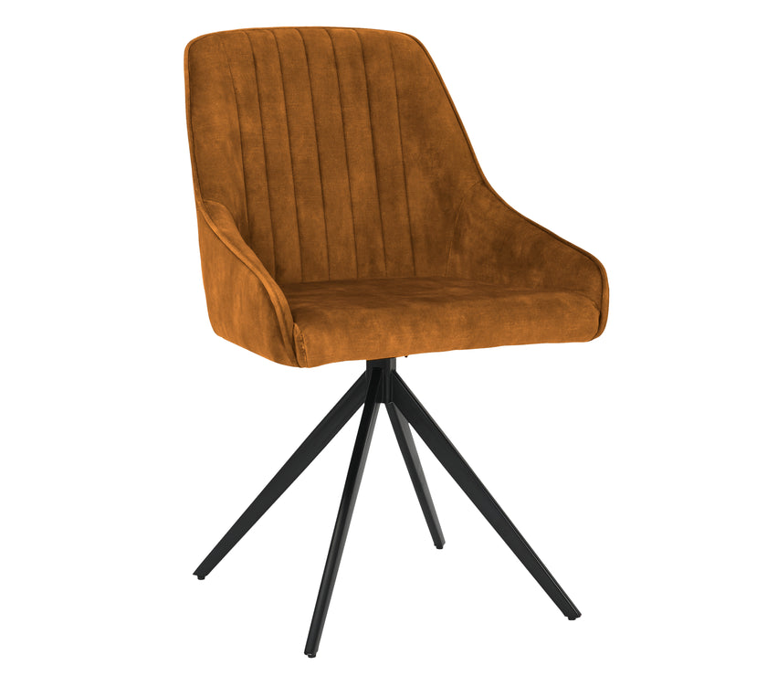 Angled image of the Sofia Mustard swivel dining chairs with black metal legs and velvet upholstery.