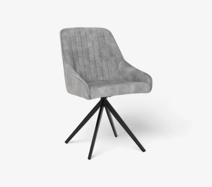 Front and angled image of the Sofia light grey swivel dining chairs with black metal legs and velvet seat.