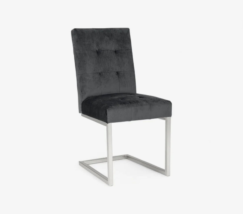 Front image of the Toulouse Velvet Dining Chairs with gunmetal fabric, chrome cantilever frame, and quilted button detailing.